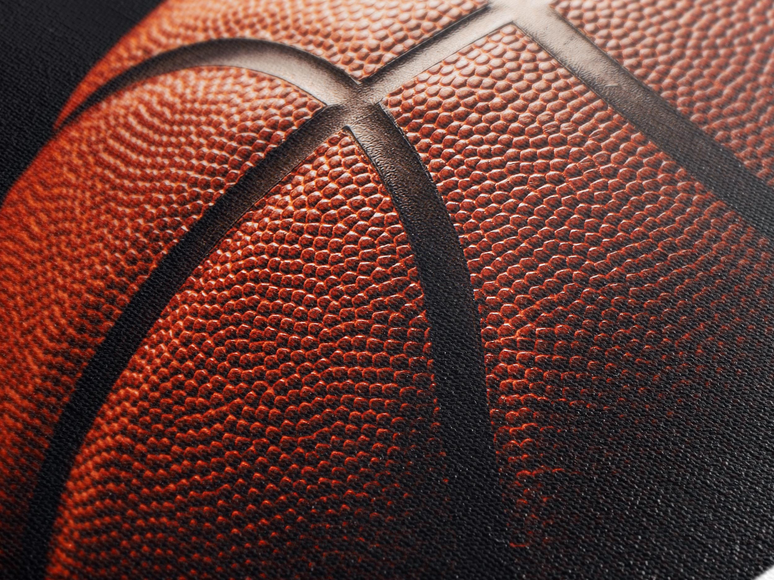 Close up view of a textured canvas print of a basketball