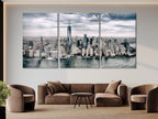 Contemporary skyline canvas print capturing towering skyscrapers beneath dramatic clouds, creating a statement artwork for refined interior design.