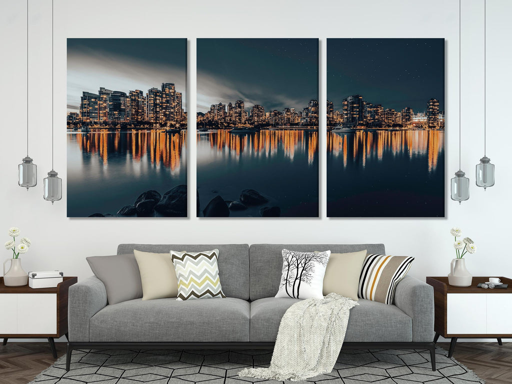 Captivating downtown Vancouver canvas print showcasing illuminated skyscrapers mirrored in still waters, delivering a contemporary urban artwork vibe.