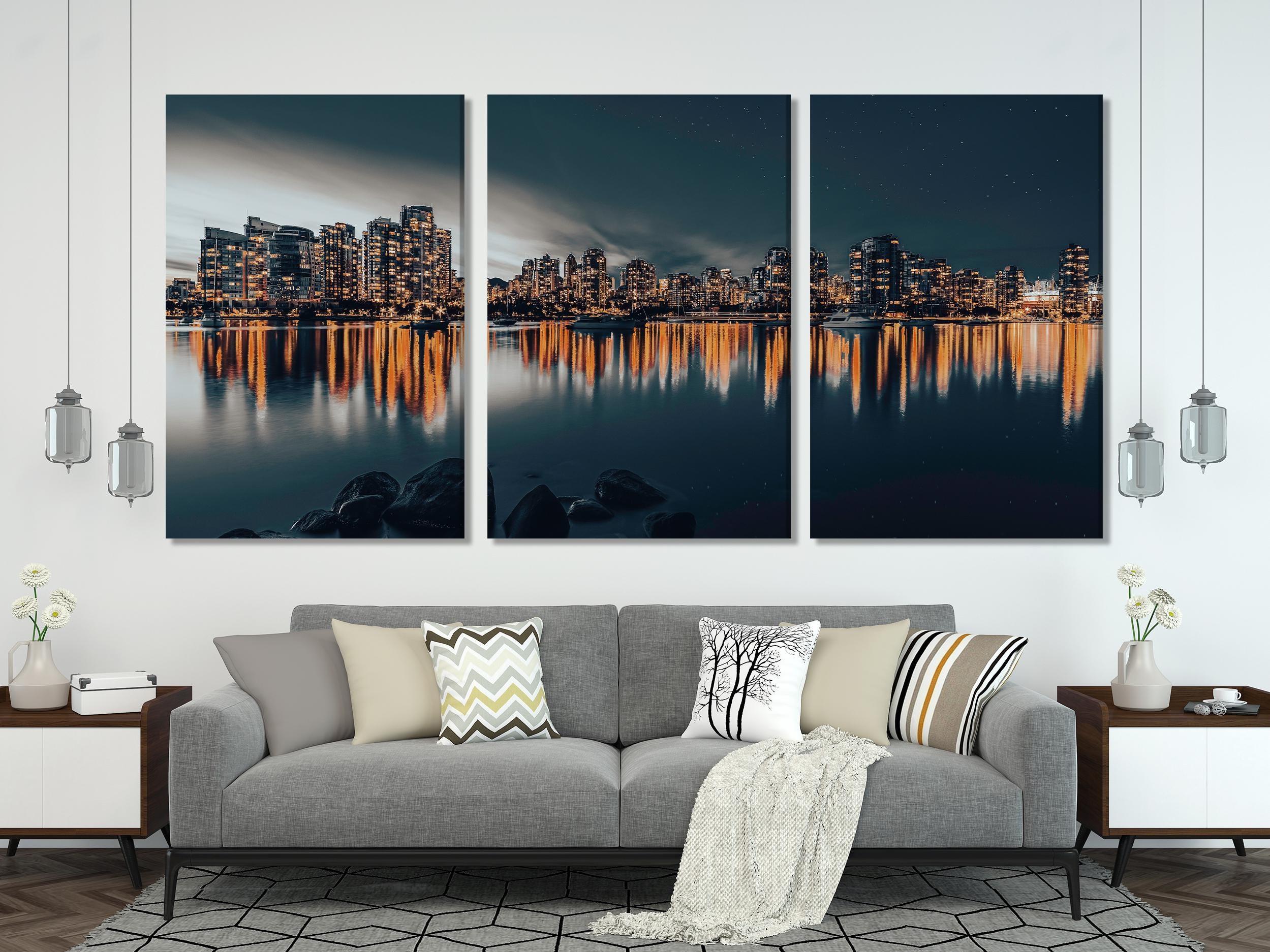 Captivating downtown Vancouver canvas print showcasing illuminated skyscrapers mirrored in still waters, delivering a contemporary urban artwork vibe.