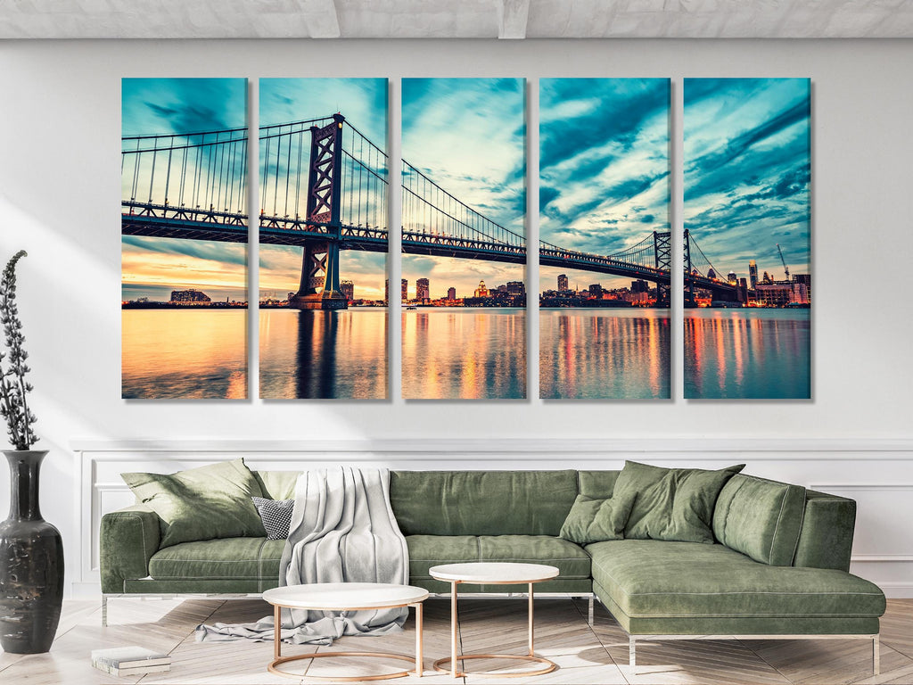 Modern city skyline wall art capturing a luminous suspension bridge at twilight, reflecting across tranquil waters for a striking urban centerpiece.
