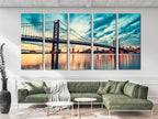 Modern city skyline wall art capturing a luminous suspension bridge at twilight, reflecting across tranquil waters for a striking urban centerpiece.