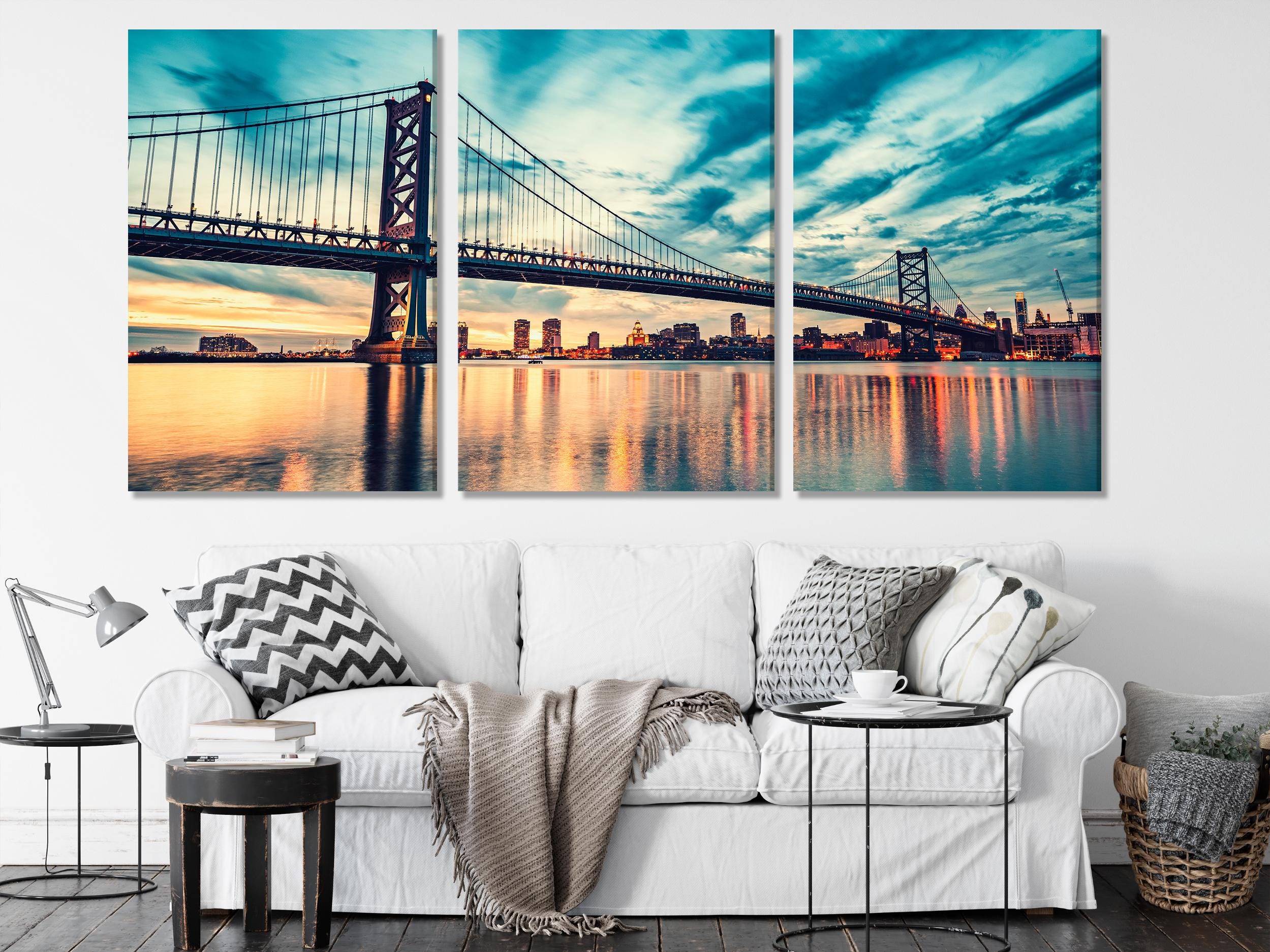 Dramatic metropolitan panorama presented as a canvas print, highlighting skyscrapers and a sweeping bridge in vivid sunset hues.