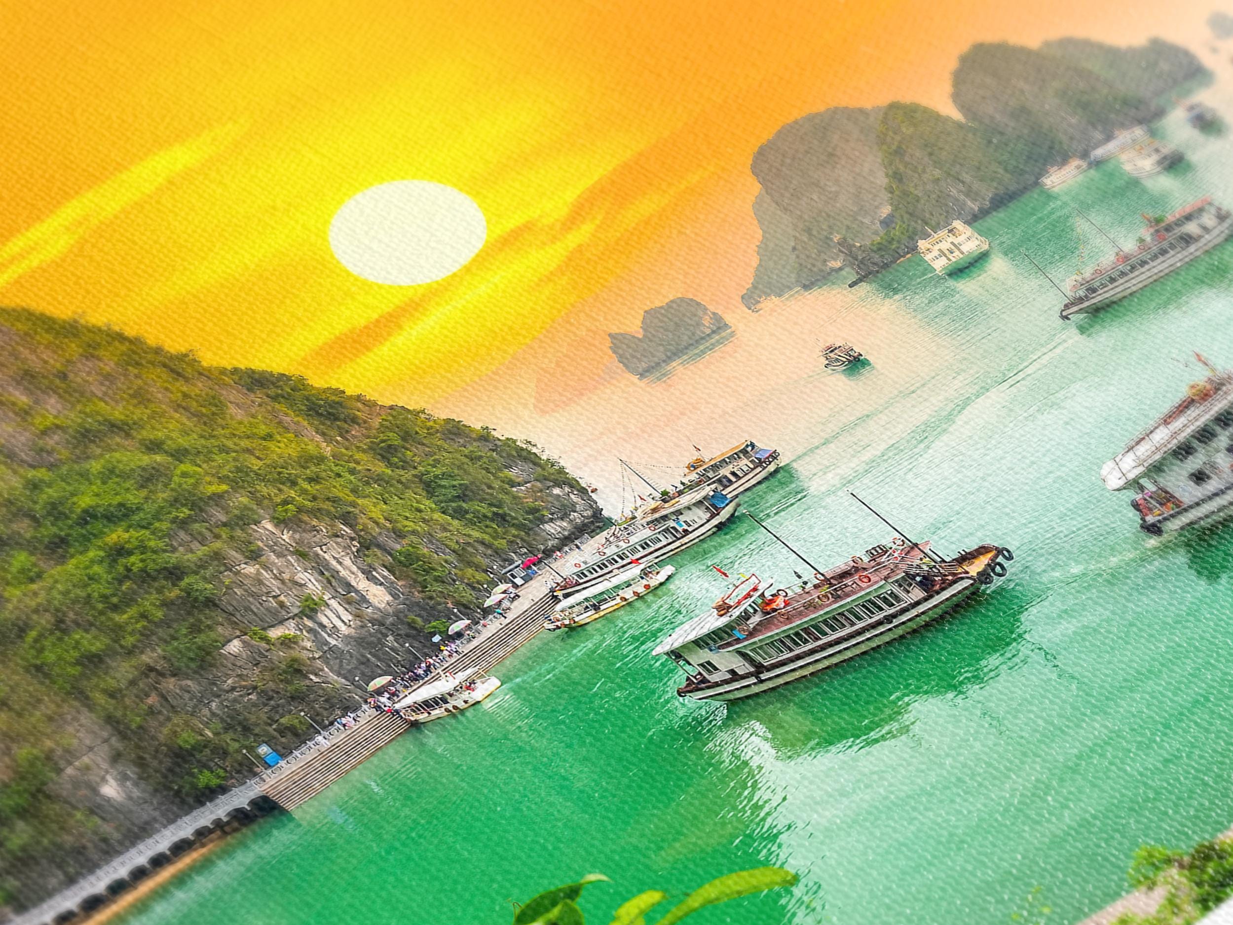 Sunlit seascape canvas print displaying green waters, tall rock formations, and sailing vessels.