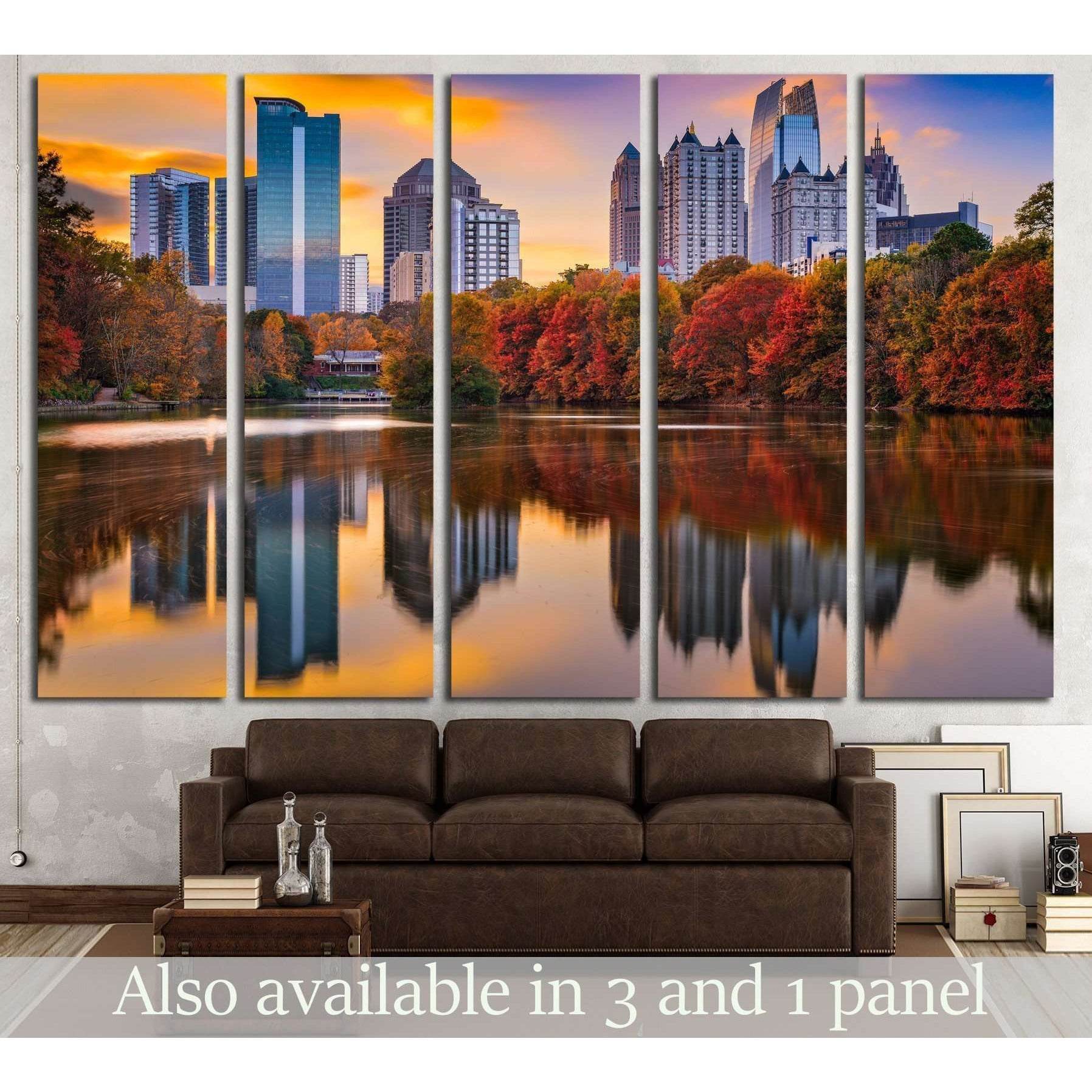 Piedmont Park skyline in autumn Atlanta, GA Canvas PrintThis triptych canvas print captures an urban skyline at sunset, reflected in the calm waters of a city park. The autumnal trees add a warm spectrum of reds and oranges to the scene, complementing the