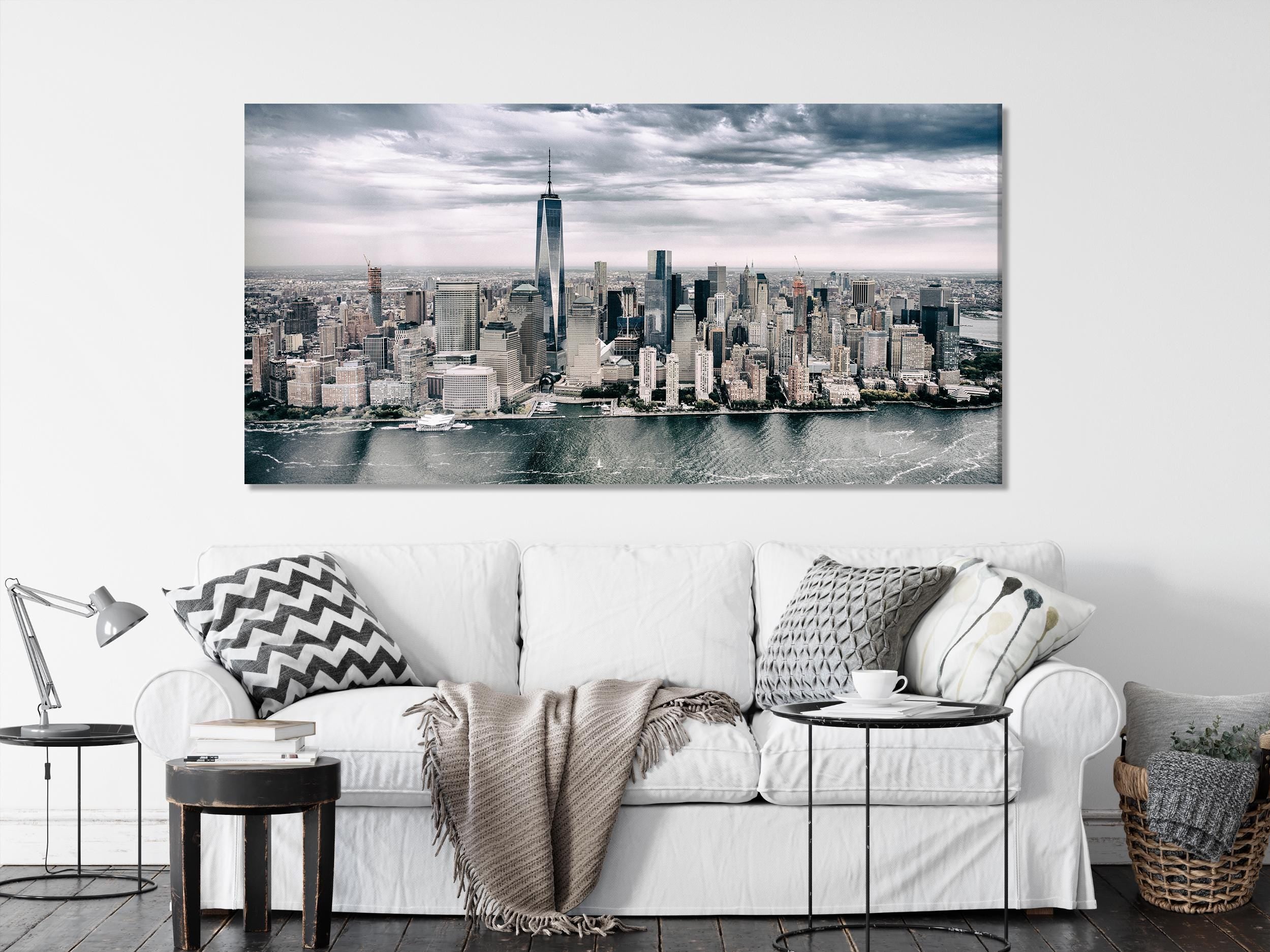Modern city skyline wall art presenting a panoramic aerial view, featuring sleek high-rises and reflective waters for a bold urban-inspired painting.