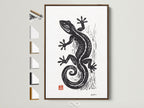 Brown frame displays available frame options. This artwork is matted and framed. A brown frame showcases a print of a black gecko. This art piece adds style to any room. Consider this framed artwork for your home.