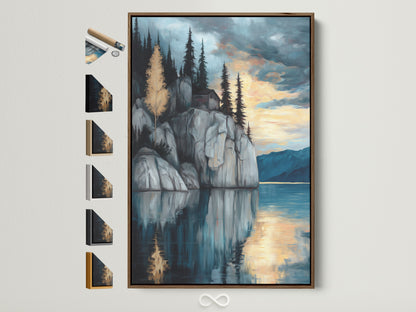 Lakeside Cliff canvas print with brown frame. Frame options are displayed on the side. This serene mountain wall art brings a moody landscape to your study room decor. The nature artwork features blue and gray hues. Reflective art creates a tranquil scene with a mountain painting reflected in water.