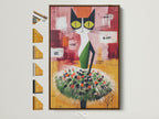 Abstract Cat art print in a brown frame. The artwork features a cat in a tutu with green and orange accents. This folk art canvas adds a whimsical touch. It is perfect for kids' room decor or a playful art piece.