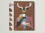 Brown frame displays Whimsical Animal Portrait artwork. This quirky home art features a deer gentleman enjoying tea. Ideal modern folk art print for office wall decor or eclectic home decor. Explore our animal portrait art collection. Perfect for contemporary art enthusiasts and unique wall art seekers.