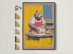 Bear Baker Canvas Print in a brown frame. See all frame options available. This whimsical kitchen wall art is perfect for dining room decor. The chef bear artwork adds a touch of humor. It is great for food enthusiasts seeking unique animal art and bakery wall decor.