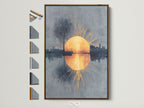 A captivating sunrise reflection artwork is framed in a warm brown. The artwork presents a golden sun rising over a cityscape. The reflection shimmers on the water below. Frame options are displayed beside it showing available choices.