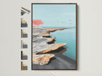 Framed coastal seascape artwork with a brown frame is displayed. The artwork features an abstract shoreline scene. It offers a modern minimalist aesthetic. Multiple frame options are visible to the side. This artwork is perfect for adding a serene touch to any room in your home.