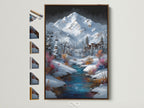 Brown frame displays a winter mountain village art print. The artwork shows a snowy mountain scene with a ski lift and flowing stream. Explore frame options to perfectly complement your cabin decor. This alpine landscape brings the serenity of a ski resort to your walls.