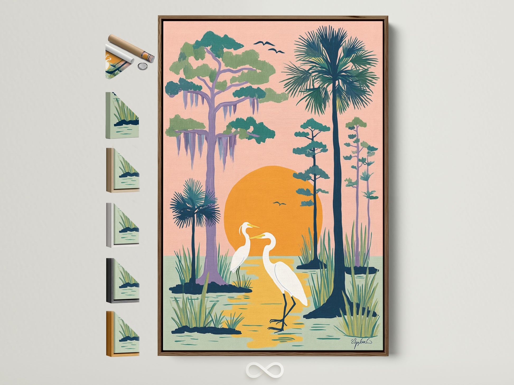 Framed heron artwork on a wall. The artwork features two herons standing in a peach colored swamp. The sun sets behind them. The art is framed in a natural brown frame. Frame samples are displayed on the side. Perfect coastal wall art.