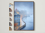 Explore framed cityscape river art. This European architecture wall art features a misty blue cityscape photography. Options displayed show various frame styles. Enhance your office decor with this urban landscape.