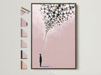A pink minimalist wall art piece is displayed in a brown frame. Several frame options are presented beside it. This abstract silhouette art print adds a modern touch. Perfect for office space decor or contemporary print collections.
