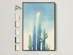 Cactus canvas print in a brown frame. The image displays all available frame options on the side. Southwestern teal blue artwork adds a touch of desert charm to entryway decor. It's perfect for homeowners and interior decorators seeking southwestern artwork.
