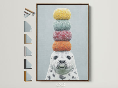 Whimsical seal artwork with colorful stacked macarons on its head. The art is framed in a brown frame. See available frame options. This playful animal art is perfect for a kids room or nursery. Add a touch of quirky charm to your home decor with this delightful seal canvas print.