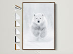 A polar bear artwork is showcased with various frame options displayed beside it. The brown frame accentuates the monochrome art adding warmth to the minimalist wall decor. Perfect arctic wildlife art for contemporary homes seeking nursery wall art.
