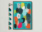 A mid-century modern artwork in a brown frame is mounted on a white wall. This abstract canvas features teal orange and geometric shapes. See all frame options displayed on the side. Perfect home wall decor to elevate your space.