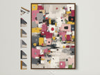 Brown frame displays abstract colorful canvas art. Modern geometric wall art complements minimalist modern or eclectic styles. Pink yellow decor enhances any office or living space. All frame options are showcased.