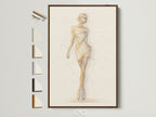 Ballet Dancer Art Print displayed in a brown frame on a white wall. This figure drawing wall art is perfect for studio decor. All frame options are visible on the side. The artwork has a contemporary style. It features primary gold and secondary beige colors.