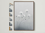 Minimalist flower art in a brown frame adds warmth to any room. This soft gray and white botanical wall art brings a touch of nature indoors. The light wood frame complements the delicate flower artwork. Frame options are displayed showing you the many ways you can customize your artwork.