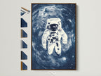 A captivating astronaut space artwork print is displayed in a brown frame. This wall art showcases a blue galaxy backdrop. Frame options are arranged beside it. Perfect for homeowners and interior designers seeking contemporary art.