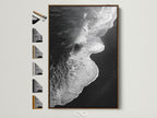 A stunning black and white ocean wave artwork print is showcased in a brown frame. This display includes various frame choices. It is perfect for coastal wall art enthusiasts. Discover minimalist beach photography for serene bedroom decor. The artwork captures the essence of ocean photography. It offers a modern coastal art vibe.