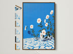 Floral canvas art is displayed in a brown frame. The artwork features azure blue wall art. It is a botanical print perfect for entryway wall decor. See all frame options to find the ideal match for your artwork.