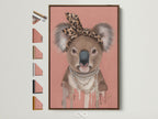 Brown Frame displays Koala Wall Art options. This trendy animal canvas print features a Koala wearing a leopard print headband and pearl necklace. Ideal modern art for nurseries and kids' rooms. Various frame choices are showcased.