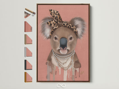 Brown Frame displays Koala Wall Art options. This trendy animal canvas print features a Koala wearing a leopard print headband and pearl necklace. Ideal modern art for nurseries and kids' rooms. Various frame choices are showcased.