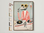 A framed Frog DJ art print is displayed with other frame options. It showcases available frame styles. Find the perfect frame to complement your quirky animal artwork. Elevate your space with retro music posters and funny animal canvas prints.