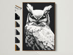 A striking owl artwork in a brown frame is displayed. Several frame options are showcased alongside it. The artwork features a black and white owl created in a modern dotted style. Ideal wall art for study rooms or minimalist spaces. Perfect for wildlife art enthusiasts seeking unique decor.