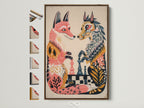 Framed fox chess game artwork with a brown frame. The artwork features two stylized foxes. They are poised over a chess board. Frame options are displayed to the side showcasing the variety available.