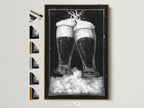 Brown frame artwork. The art features two beer glasses in black and white tones. It is displayed on a wall. The frame is a light brown wood. Discover framed artwork options to enhance your space. Explore our selection today for the perfect piece.