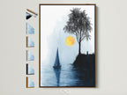 Coastal wall art featuring a sailboat and tree at sunset is displayed in a brown frame. Multiple frame options are showcased. Perfect minimalist seascape artwork for office decor or nautical themed rooms. The blue and yellow tones evoke a serene and calming atmosphere. A great addition to any coastal themed space. Discover our range of framed art prints today.