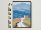 Tuscan Landscape artwork with a brown frame. Frame options displayed on the side. This rolling hills wall art is perfect for farmhouse decor. The artwork features yellow and blue tones adding a calming touch to any room. Consider this framed artwork for your home or office.