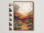 A serene desert landscape artwork is framed in a light brown frame. The artwork features warm earth tones and a bright sun. Frame options are displayed beside the framed art. This allows for easy customization. It brings nature-inspired art to your home.