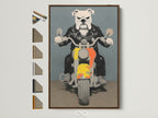Bulldog Biker artwork in a brown frame. The artwork features a bulldog wearing a leather jacket riding a motorcycle. The artwork is displayed with various frame options. Perfect wall art for a man cave or garage.