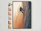 Rock climbing artwork in a brown frame. This adventure wall art features an urban mountainscape. The artwork is displayed with other frame options. Perfect office decor for adventure seekers.