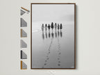 Beach Walk canvas art in a brown frame displays all frame options. Children hold hands in this black and white seascape photograph. Perfect nursery wall decor. Coastal artwork brings a minimalist touch. Shop now for kids room art family photo.