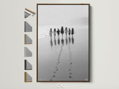 Beach Walk canvas art in a brown frame displays all frame options. Children hold hands in this black and white seascape photograph. Perfect nursery wall decor. Coastal artwork brings a minimalist touch. Shop now for kids room art family photo.