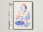 DJ Turntable artwork in a brown frame. All frame options are displayed. This retro music art is perfect for studio wall art. It is a great gift for any music lover or producer. The primary color is blue and the secondary color is orange. Add a touch of retro flair to your space with this unique piece.