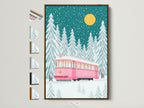 Modern winter tram artwork with a pink train and snowy forest scene. The art is framed in a brown frame. This image shows available frame options. Perfect for a festive touch to any room. It is ideal for kids rooms or as a Christmas gift.