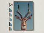 A framed art print is displayed. The art features an Impala with large spiraling horns. The frame is a brown wood. See all our frame options to find the perfect style for your art.