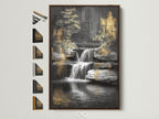 Waterfall canvas art with a brown frame. View all frame options available. This tranquil artwork brings an urban oasis to your space. The zen garden print offers golden accents. This nature canvas art is perfect for office meditation or spa wall decor.