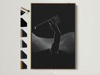 Modern sports wall art featuring a minimalist golfer. The golfer is captured mid-swing in a black and white silhouette. The artwork is framed in a natural brown frame. See all frame options to customize your golf artwork.