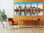 Modern cityscape artwork exhibiting geometric building designs, calm waters, and a warm sunset palette, ideal for infusing metropolitan elegance into any space.